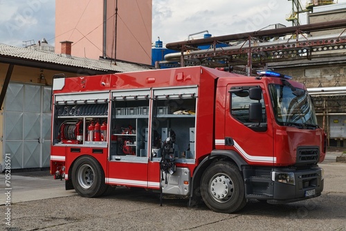 A state-of-the-art firetruck, equipped with advanced rescue technology, stands ready with its skilled firefighting team, prepared to intervene and respond rapidly to emergencies, ensuring the safety