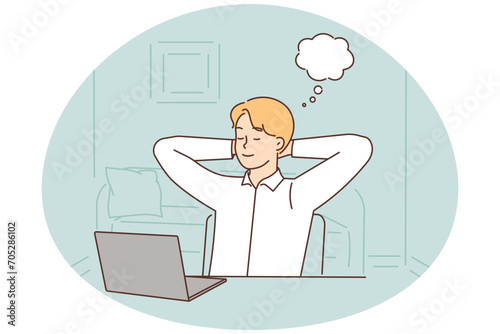 Young woman distracted from computer work dreaming