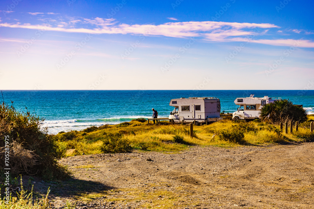Tourist traveling by camper, camp on seashore, Spain