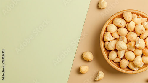 Shelled macadamia nuts on a two-color background photo