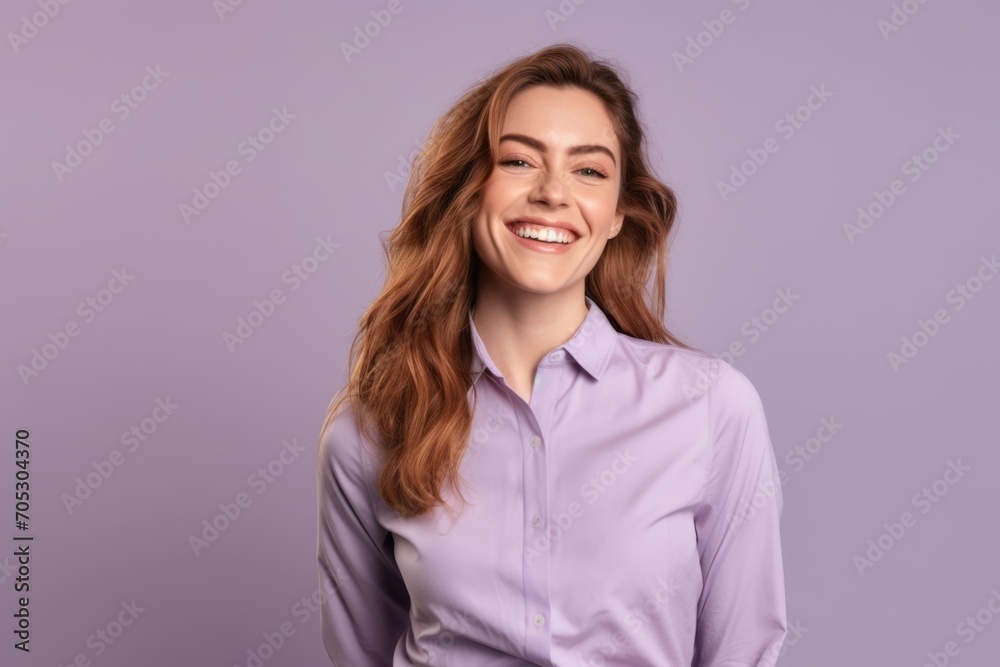 Portrait of a smiling young business woman standing against purple background. Portrait of a smiling young business woman standing against purple background.