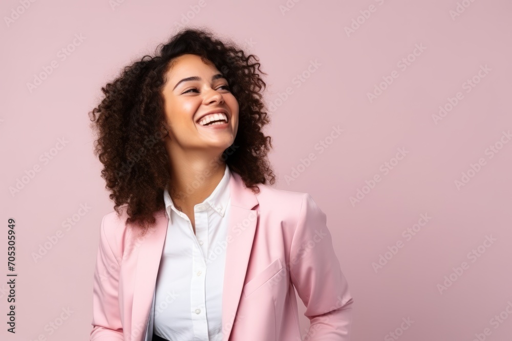 Portrait of a beautiful young african american woman laughing over pink background Portrait of a beautiful young african american woman laughing over pink background