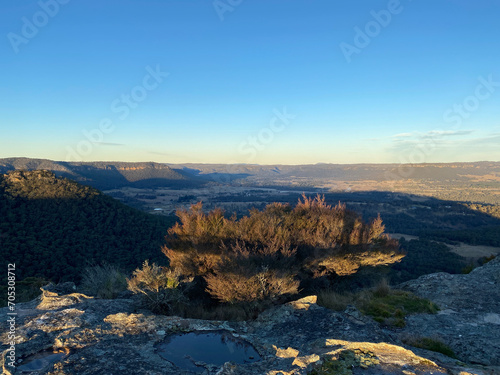 Spectacular views from a mountain-top lookout. Mountains in the horizon. Blue mountains  Australia. Grand canyon sunset. Unusual rock formation. Summit of the mountain.