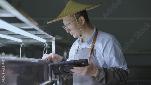 man agriculture technican working with tablet photo
