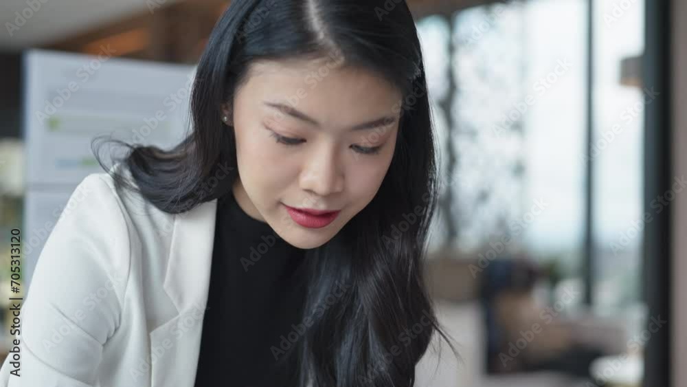 Business woman analyzing data paperwork calculating numbers Business woman analyzing data paperwork calculating numbers