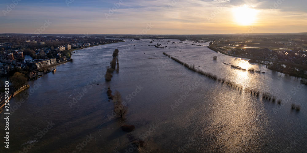 Aerial panorama showing extreme high water level of river IJssel in Zutphen, The Netherlands with inundated floodplains and waterway out of its normal flow riverbanks