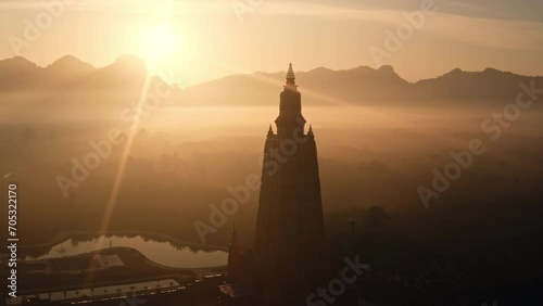 Wallpaper Mural Aerial sunrise view of a majestic Buddhist temple in Thailand, fog and mountains in the background Torontodigital.ca