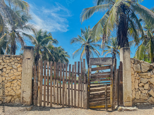 entrance to the beach with wooden planks and rock wall