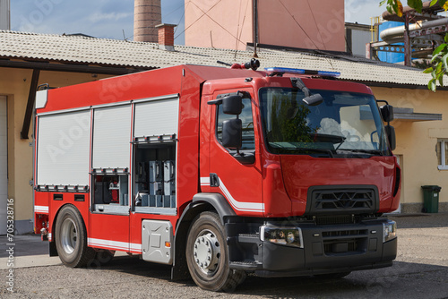 A state-of-the-art firetruck, equipped with advanced rescue technology, stands ready with its skilled firefighting team, prepared to intervene and respond rapidly to emergencies, ensuring the safety