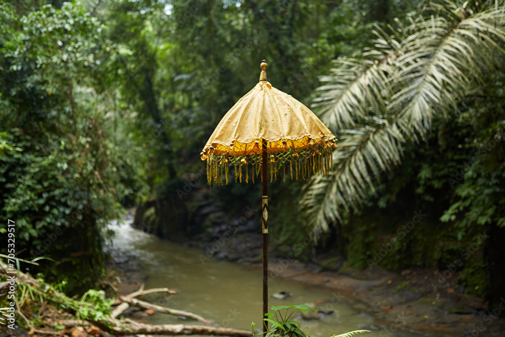 Traditional umbrellas at a jungle temple on the popular tourist island of Bali.