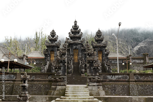 The large sacred traditional temple of Pura Pasar Agung Sebudi on the mountain after the ash eruption at Mount Agung on the popular tourist island of Bali. photo