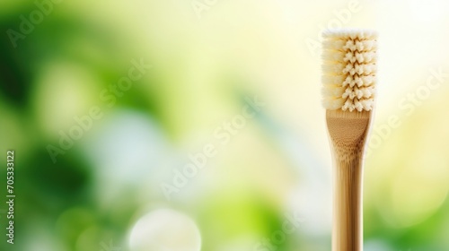 Closeup of a bamboo toothbrush  with biodegradable bristles and a compostable handle.