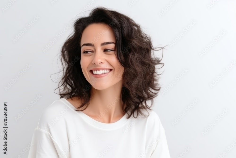 Portrait of a beautiful happy young woman smiling and looking at camera Portrait of a beautiful happy young woman smiling and looking at camera