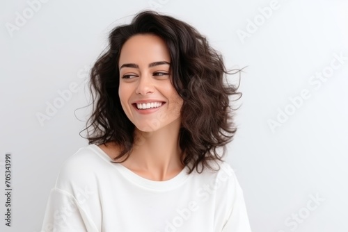Portrait of a beautiful happy young woman smiling and looking at camera