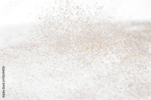 Ground Coffee roasted powder dust fly explosion, Coffee crushed ground float pouring. Roasted Coffee powder ground dust splash explosion in mid Air. Black background Isolated selective focus blur