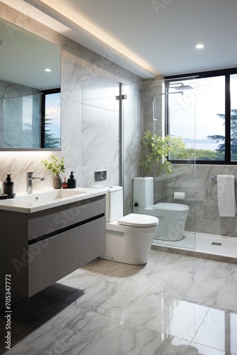 Modern bathroom interior with large windows and marble tiles