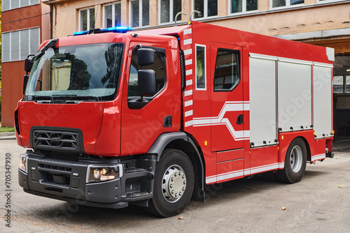 A state-of-the-art firetruck, equipped with advanced rescue technology, stands ready with its skilled firefighting team, prepared to intervene and respond rapidly to emergencies, ensuring the safety