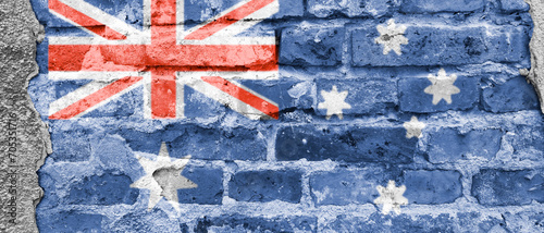 Australia flag on a brick wall. Banner. National Australia Day. Union Jack of the British Crown, Commonwealth and Southern Cross constellation on a blue background. Header for website, news, blog. © Yuliia