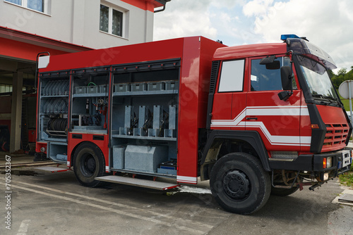 A state-of-the-art firetruck, equipped with advanced rescue technology, stands ready with its skilled firefighting team, prepared to intervene and respond rapidly to emergencies, ensuring the safety