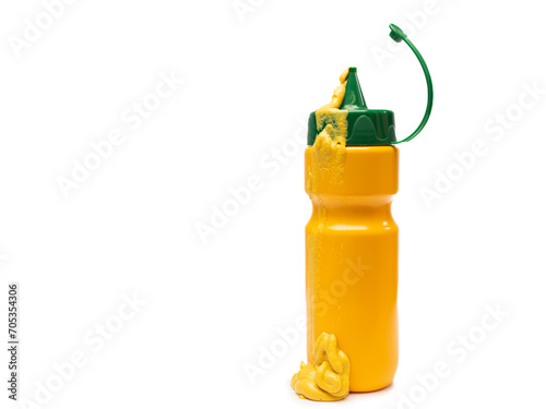 Yellow Mustard Squeeze Bottle with Mustard Dripping Down the Side