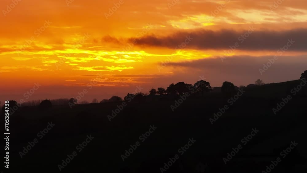 Sunset clouds over countryside landscape Sunset clouds over countryside landscape
