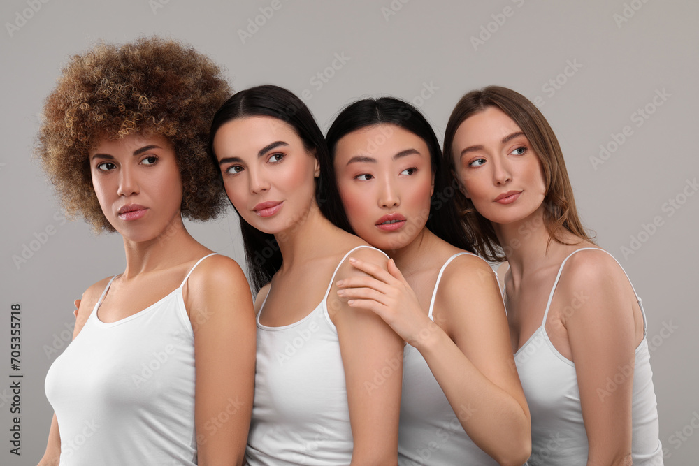 Beautiful young women with healthy skin on gray background Beautiful young women with healthy skin on gray background