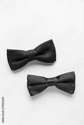 Black bow ties on white background