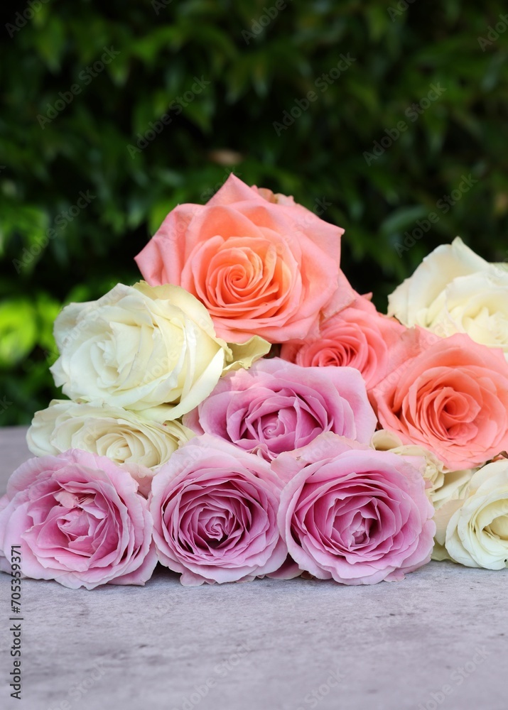 Beautiful bouquet of roses on light grey table outdoors, closeup Beautiful bouquet of roses on light grey table outdoors, closeup