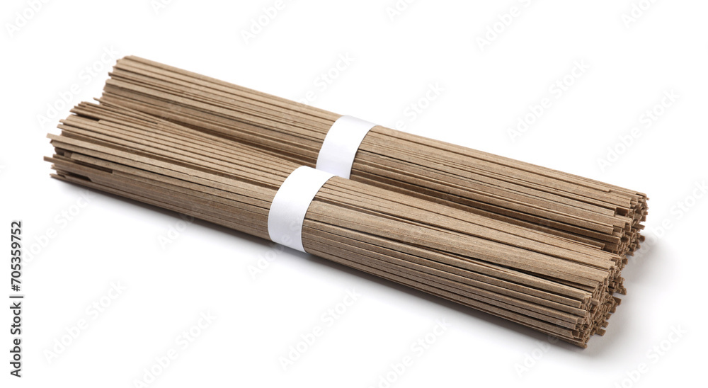 Uncooked buckwheat noodles (soba) isolated on white Uncooked buckwheat noodles (soba) isolated on white