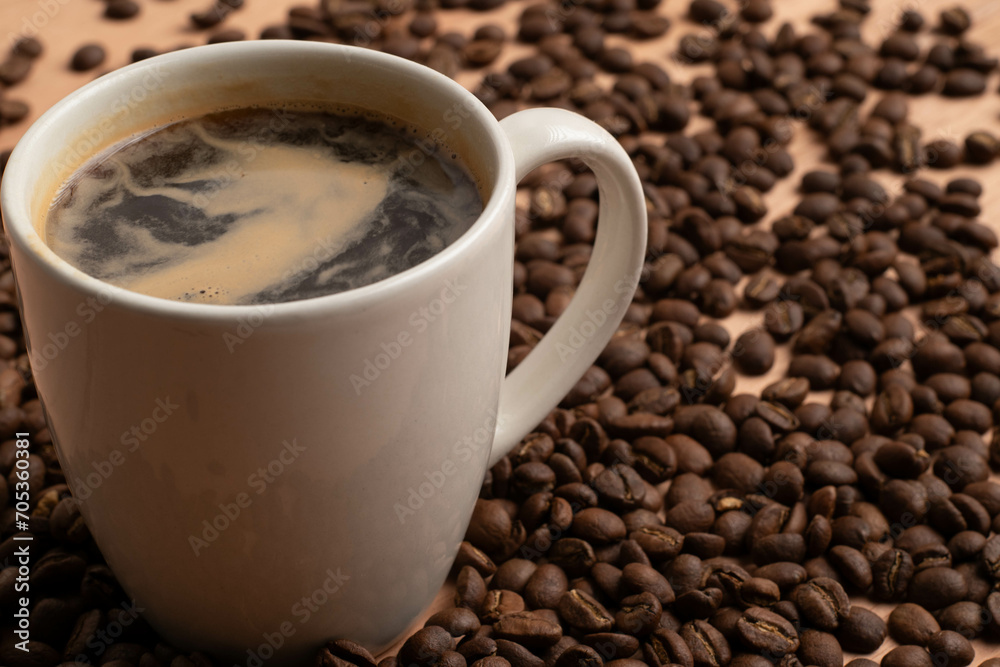 hot coffee around roasted coffee beans hot coffee around roasted coffee beans