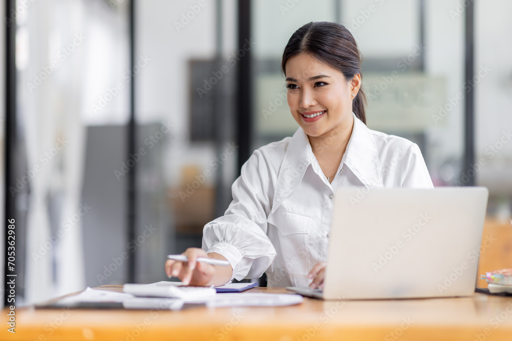 Asian Business woman work in the office. concept of tax, report, accounting, statistics, and analytical research. Asian Business woman work in the office. concept of tax, report, accounting, statistics, and analytical research.