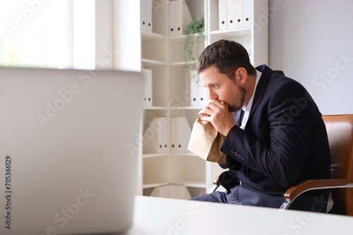 Young businessman with pape...