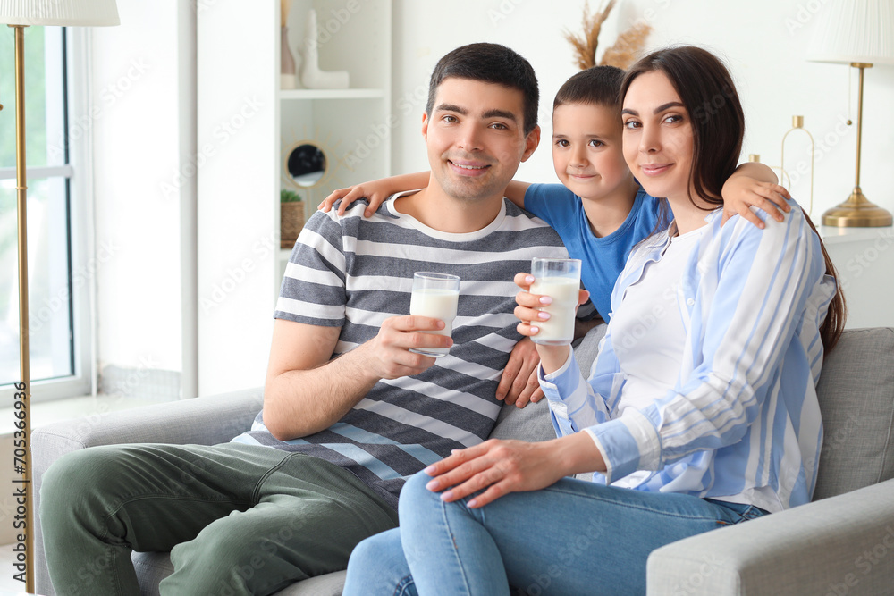 Little boy hugging his parents with milk at home Little boy hugging his parents with milk at home