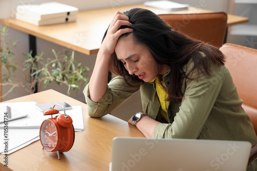 Stressed young businesswoma...