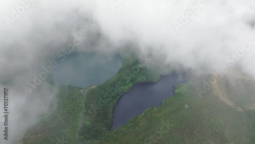 Miradouro Lagoa Negra e Lagoa Comprida with low clouds at Flores azores - drone shot photo