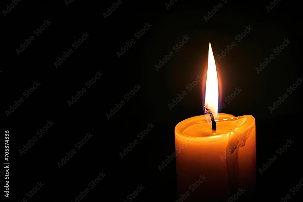 Single candle burning brightly in darkness Single candle burning brightly in darkness