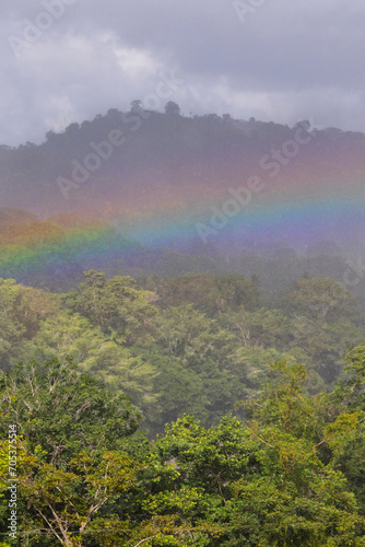 Rain and rainbow over rainforest, Alajuela, Costa Rica.