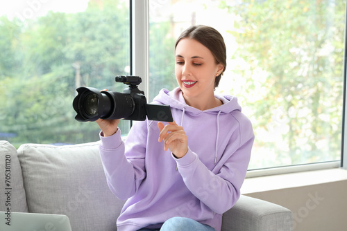 Female photographer with ca...