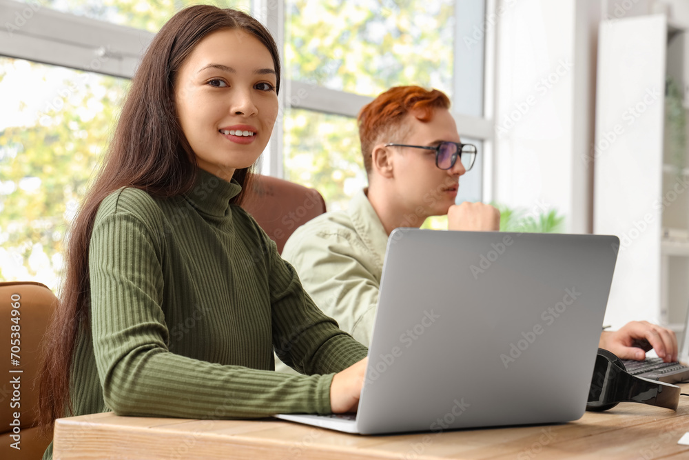 Female Asian programmer working in office