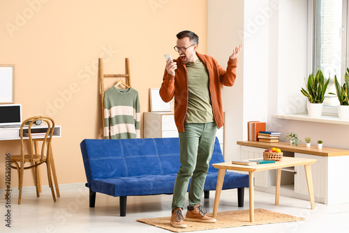 Frustrated man yelling at s...