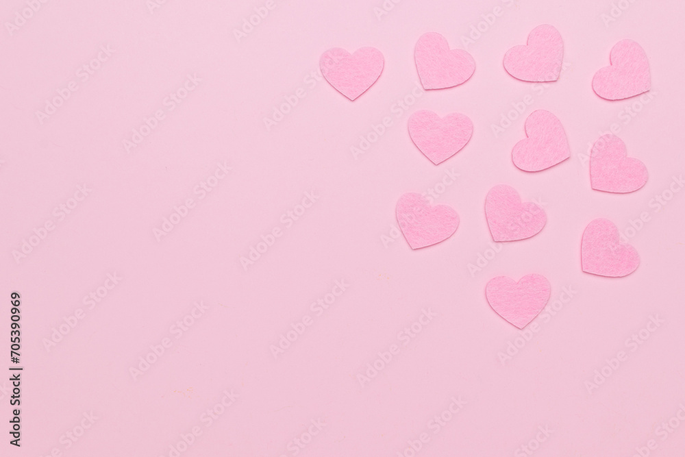 Pink hearts on a pink background.