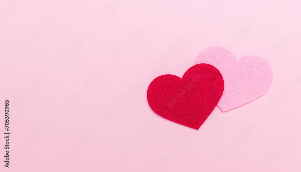 A red and pink heart on a pink background. A place for your text.
