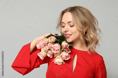 Smiling woman in red dress ...