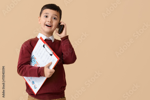 Cute little businessman wit...