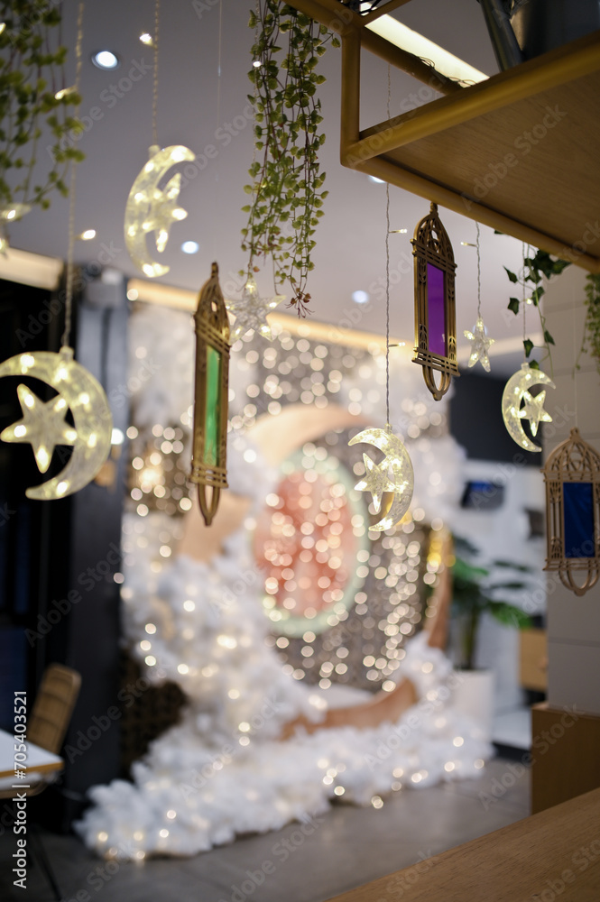 crescent moon decoration with soft white cotton and small blinking lamps for special holiday seasonal ramadan or valentine day decoration in a cafe or restaurant