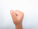 Close up of the hand of a child on a white background.