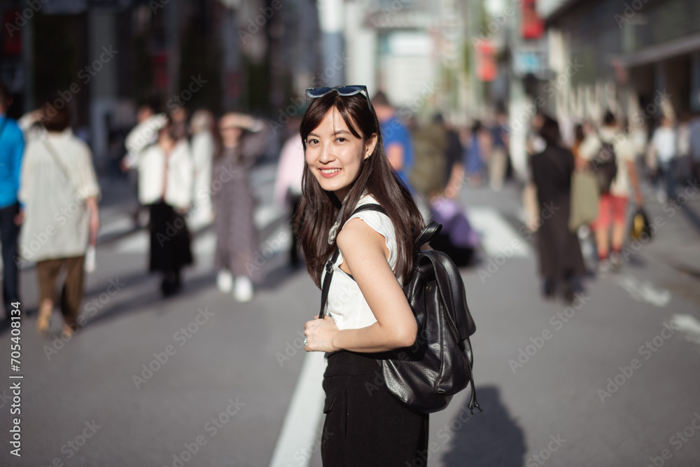 Urban chic, Trendy young lady in Tokyo, radiating positivity and success, showcasing the dynamic lifestyle of modern Japanese women.