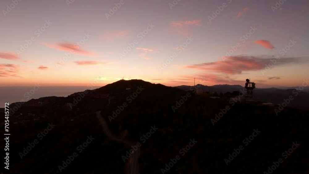 Aerial Forward Scenic View Of Plants On Mountain Range Under Orange Cloudy Sky At Sunset - Malibu, California Aerial Forward Scenic View Of Plants On Mountain Range Under Orange Cloudy Sky At Sunset - Malibu, California