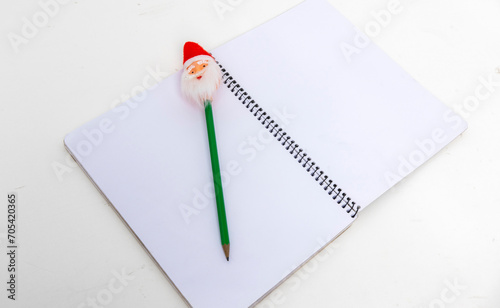 Foto Empty exegesis book with Santa pencil on table