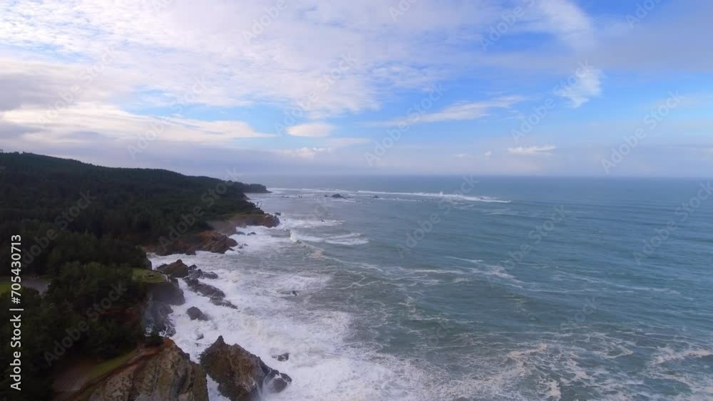 Aerial Backward Idyllic View Of Wavy Sea And Trees On Cliff Under Cloudy Sky - Shore Acres, Oregon Aerial Backward Idyllic View Of Wavy Sea And Trees On Cliff Under Cloudy Sky - Shore Acres, Oregon